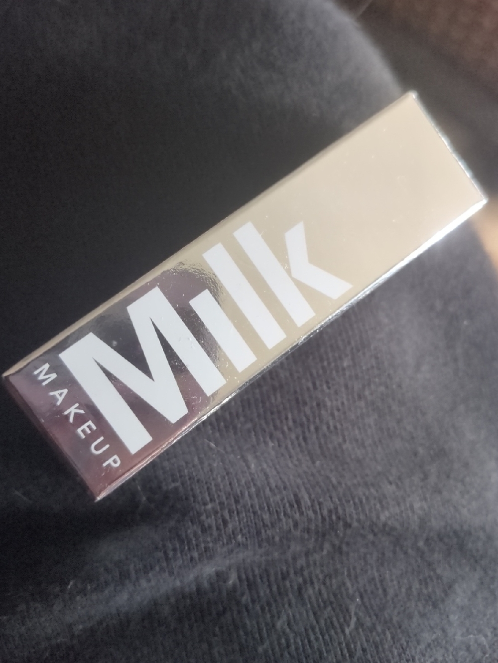 Milk Makeup Metallic Gold Lipstick Tube with White Logo